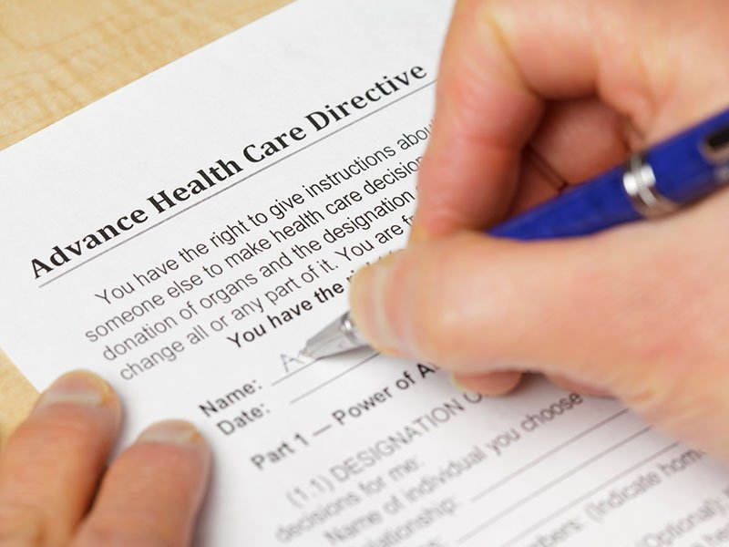 Advanced Planning - Photo of someone filling out an advanced health care directives form